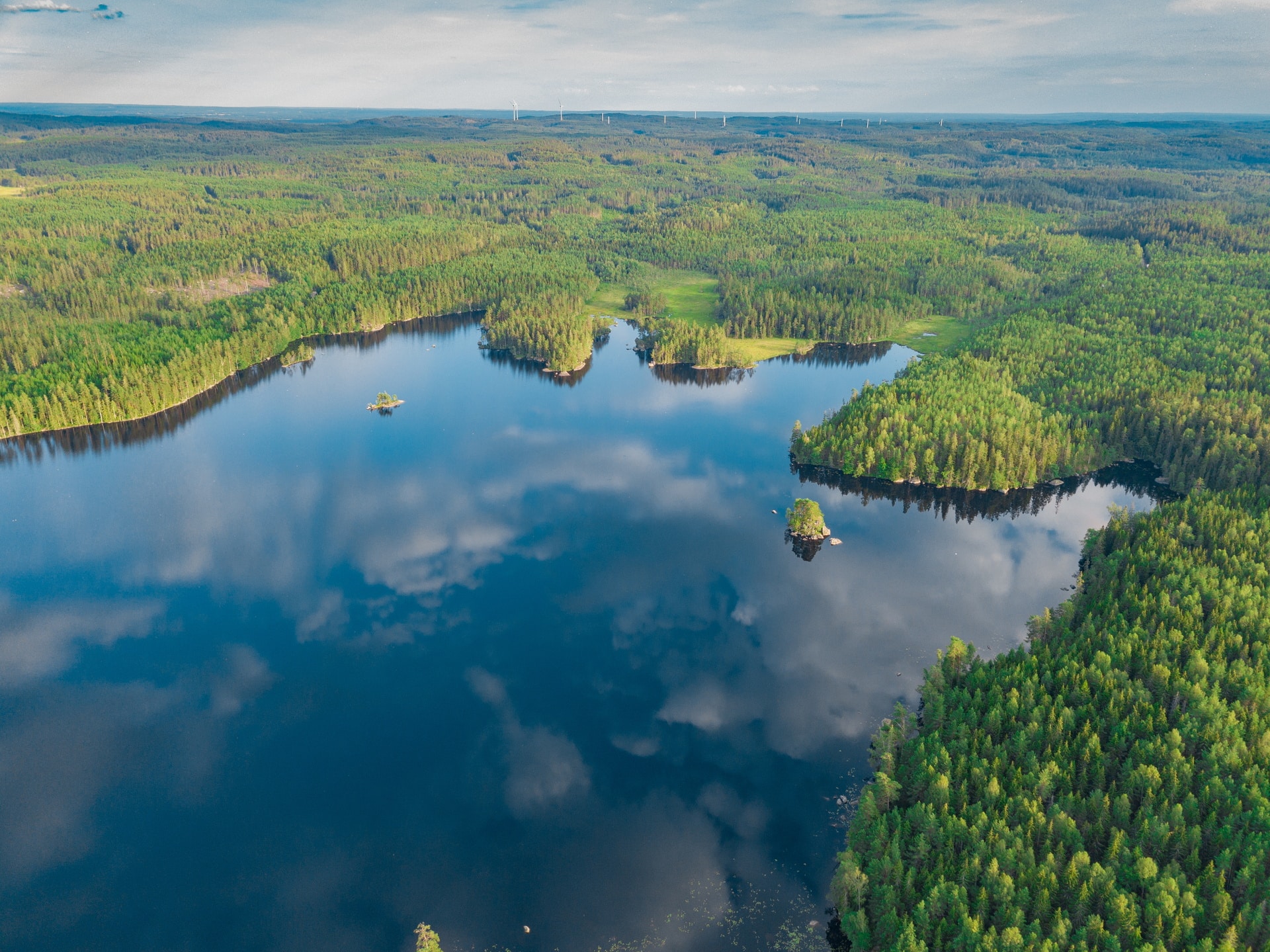 An aerial shot of the lake Vanern surrounded with amazing greenery in Sweden