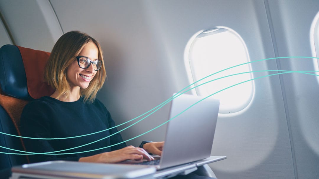 common-woman-working-on-plane-offline-teal-wave-1080x608px