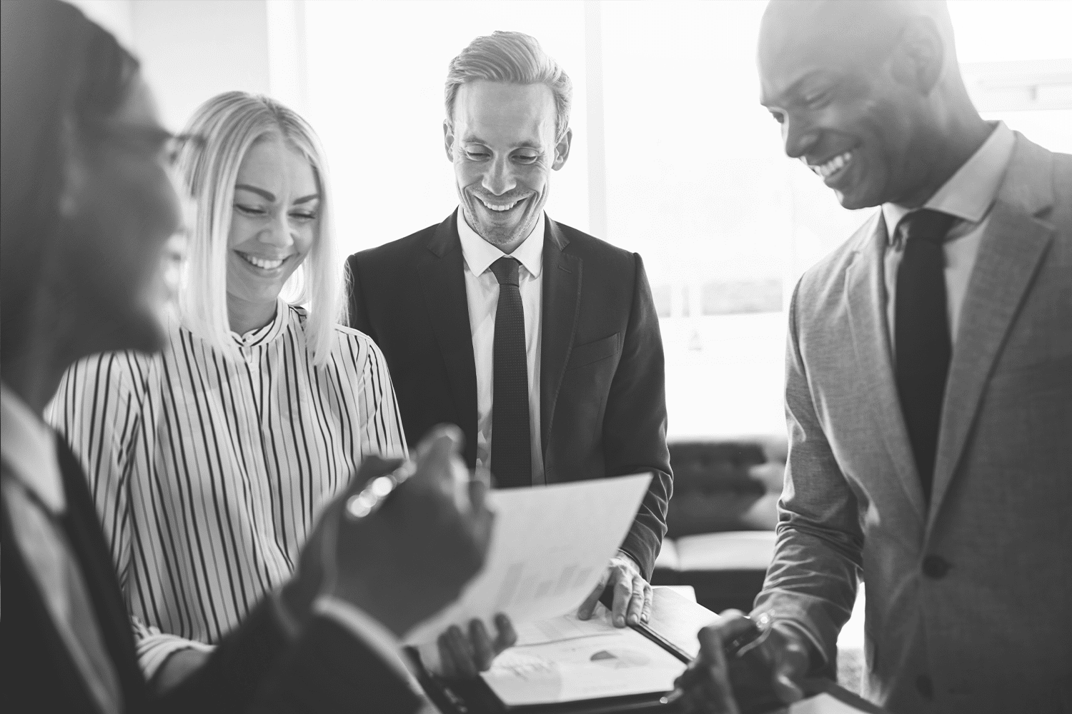 diverse-businesspeople-smiling-while-meeting-toget-2021-08-27-11-10-24-utc-BW